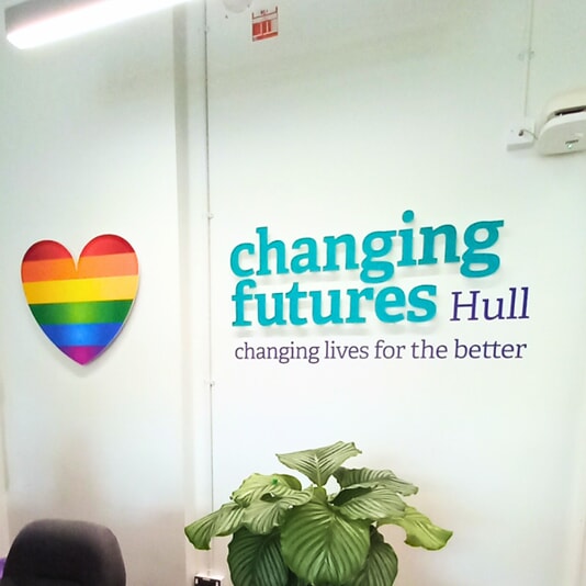 An image of the FASTSIGNS Hull "changing futures" indoor wall signage.